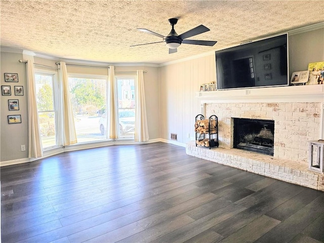 unfurnished living room with a fireplace, crown molding, a ceiling fan, and wood-type flooring