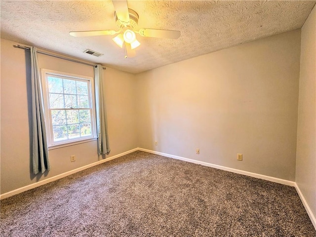 carpeted empty room featuring a textured ceiling, baseboards, visible vents, and ceiling fan