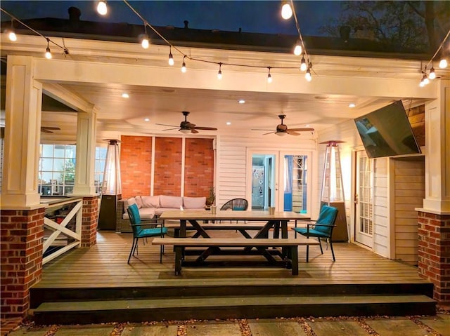 exterior space with an outdoor living space, french doors, outdoor dining area, and ceiling fan