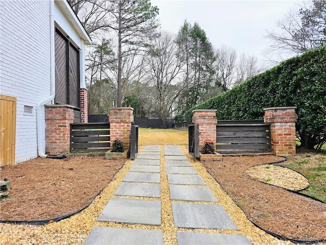 view of yard with a gate and fence