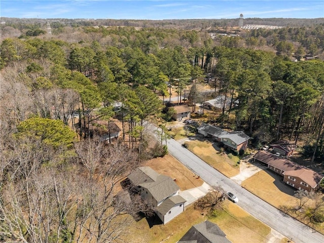 bird's eye view featuring a wooded view