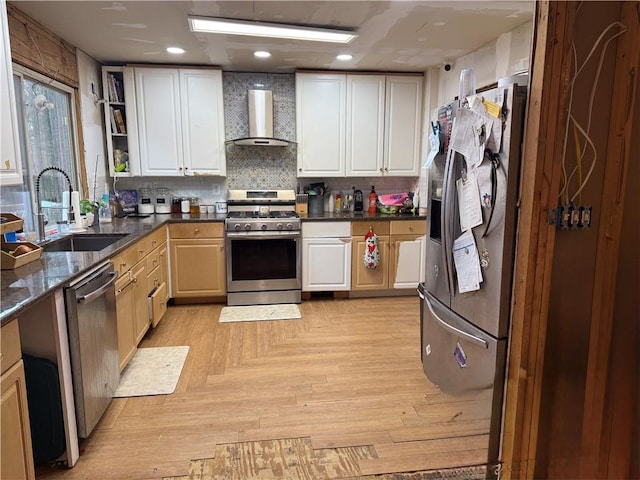 kitchen with tasteful backsplash, stainless steel appliances, wall chimney range hood, open shelves, and a sink