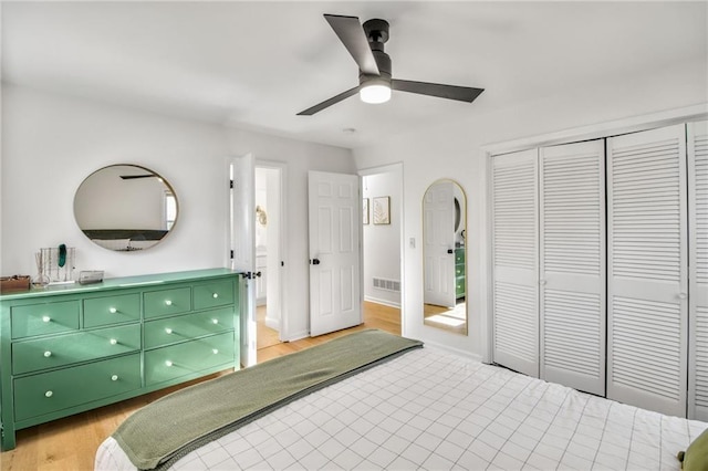 bedroom with a closet, ceiling fan, and light wood-type flooring