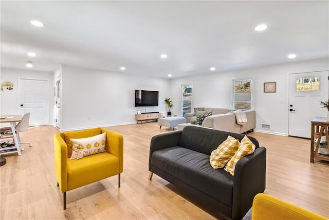 living room with light hardwood / wood-style flooring