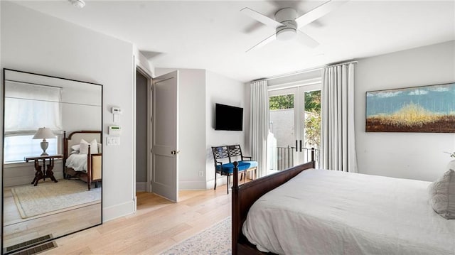 bedroom with ceiling fan and light hardwood / wood-style flooring