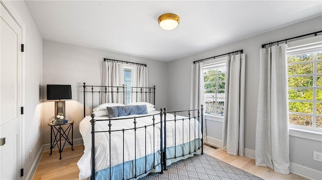 bedroom with light wood-type flooring