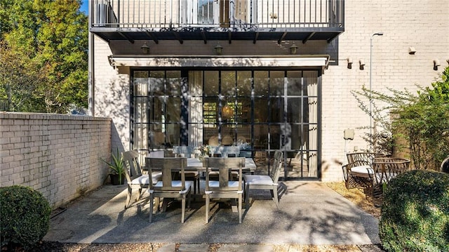 view of patio / terrace with a balcony