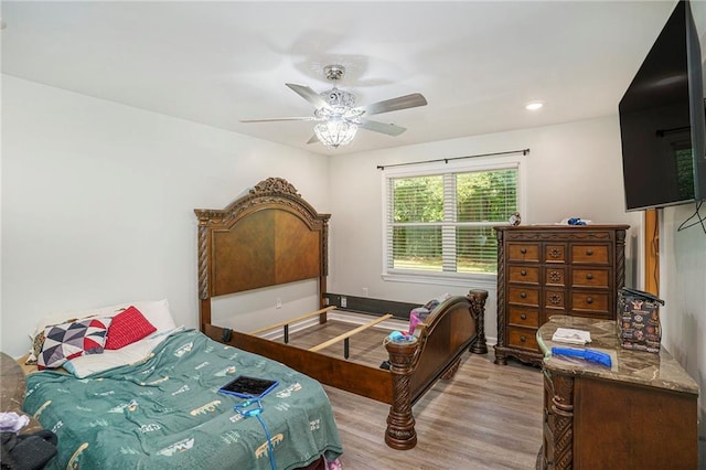 225 Hardwood Dr, Covington, GA 30016 - bedroom with wood finished floors and a ceiling fan