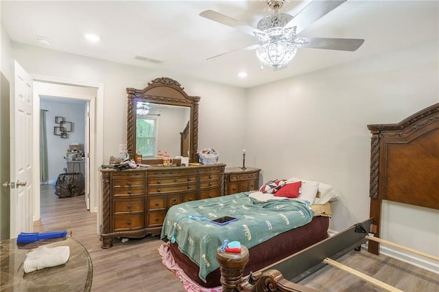 225 Hardwood Dr, Covington, GA 30016 - bedroom with wood finished floors, ceiling fan, recessed lighting, and baseboards