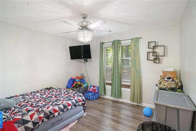 225 Hardwood Dr, Covington, GA 30016 - bedroom with wood finished floors and a ceiling fan