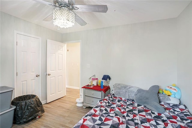 225 Hardwood Dr, Covington, GA 30016 - bedroom featuring wood finished floors and a ceiling fan