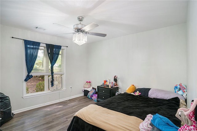 225 Hardwood Dr, Covington, GA 30016 - bedroom with wood finished floors, baseboards, and a ceiling fan