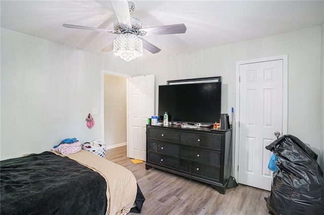 225 Hardwood Dr, Covington, GA 30016 - bedroom with wood finished floors and ceiling fan