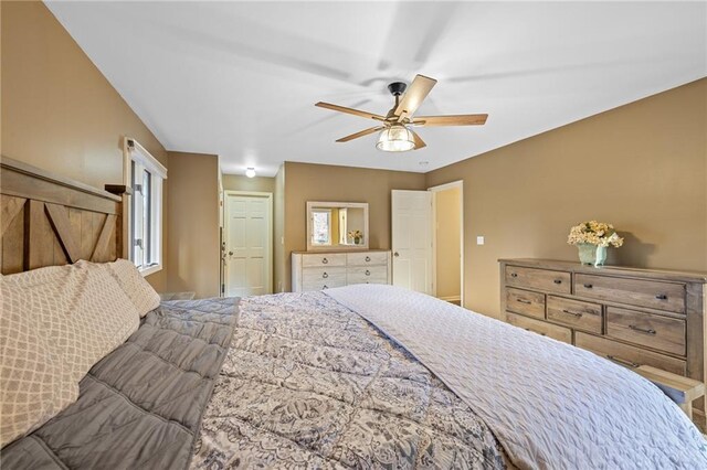 bedroom with a paneled ceiling and light carpet