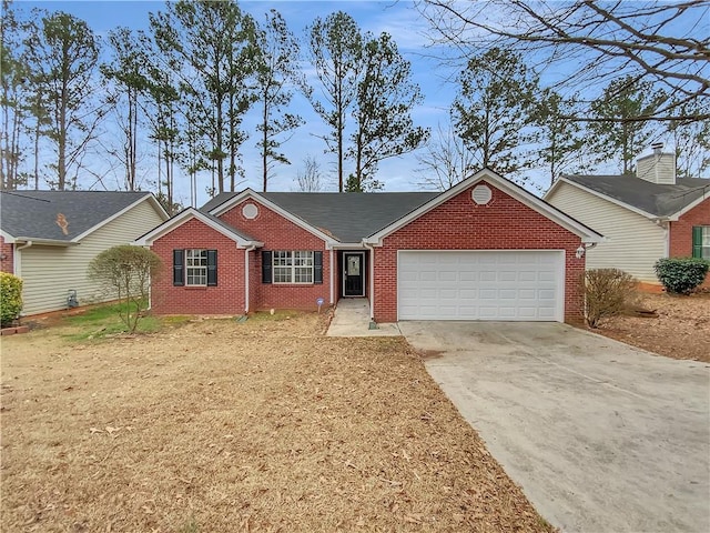 ranch-style house with concrete driveway, brick siding, and an attached garage