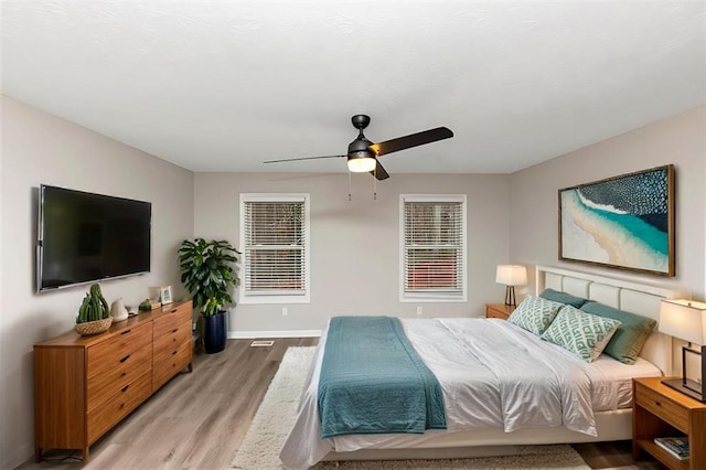 bedroom featuring ceiling fan and light wood-type flooring