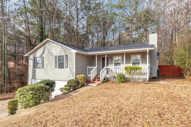 single story home featuring central AC unit and covered porch