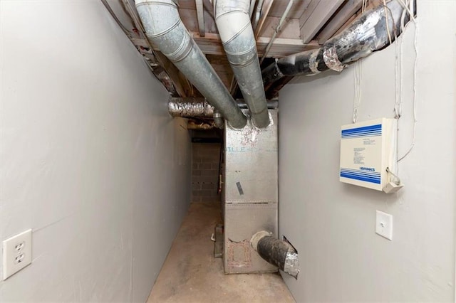 utility room featuring heating unit