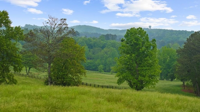 view of mountain background with rural landscape and a forest