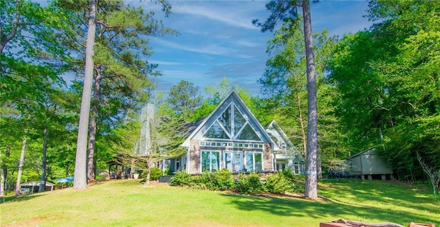 1345 Quail Hollow Dr, Hamilton, GA 31811 - rear view of property with a lawn