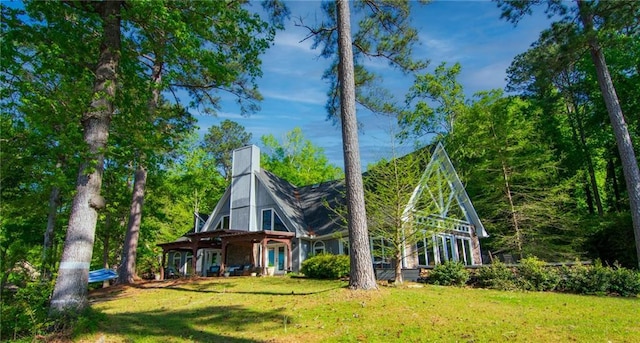 1345 Quail Hollow Dr, Hamilton, GA 31811 - exterior space featuring a chimney and a front yard