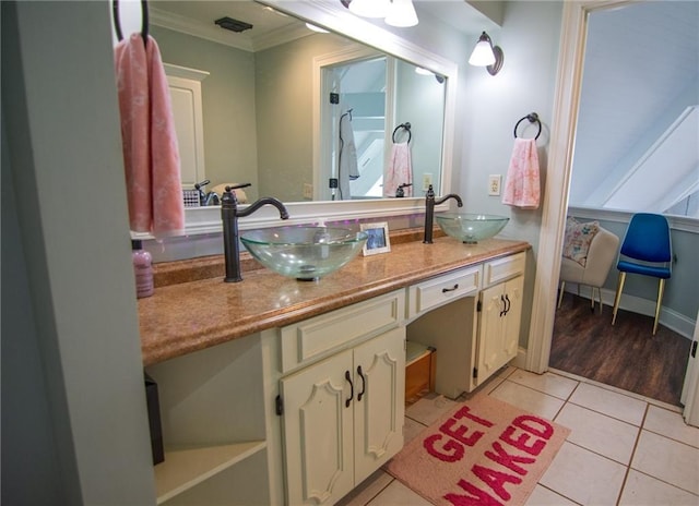 1345 Quail Hollow Dr, Hamilton, GA 31811 - bathroom with double vanity, crown molding, tile patterned flooring, and a sink