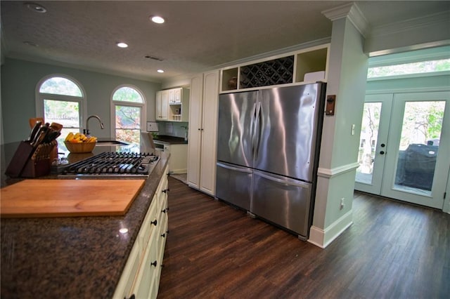 1345 Quail Hollow Dr, Hamilton, GA 31811 - kitchen with dark wood-style flooring, stainless steel appliances, crown molding, and a sink