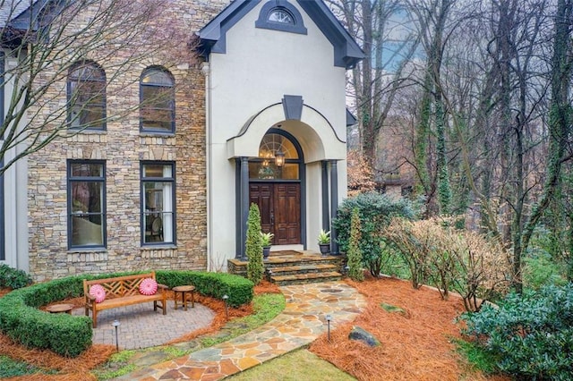 doorway to property with a patio area