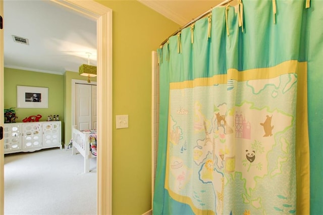 bathroom featuring crown molding