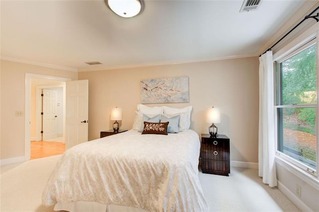 bedroom with light carpet and crown molding