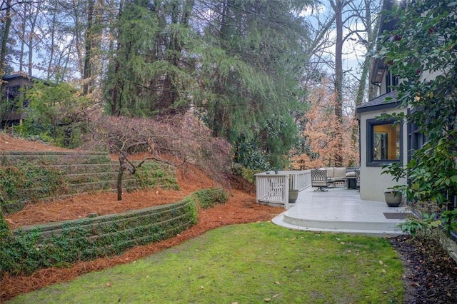 view of yard featuring a deck and an outdoor hangout area