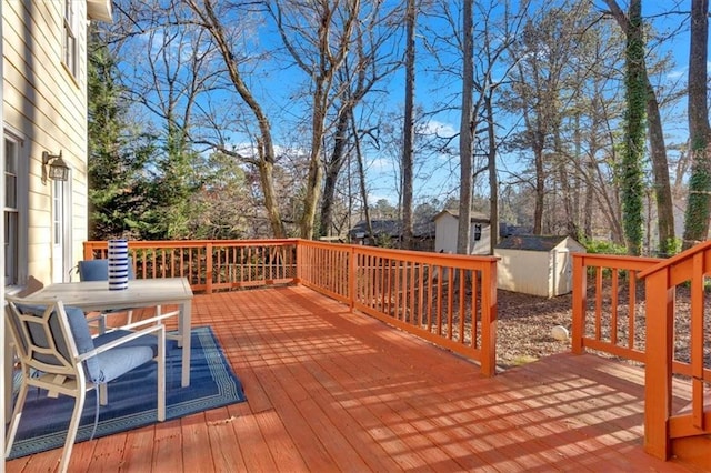 deck featuring a storage shed and an outbuilding