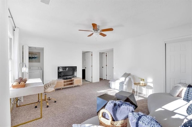 carpeted living room with a ceiling fan