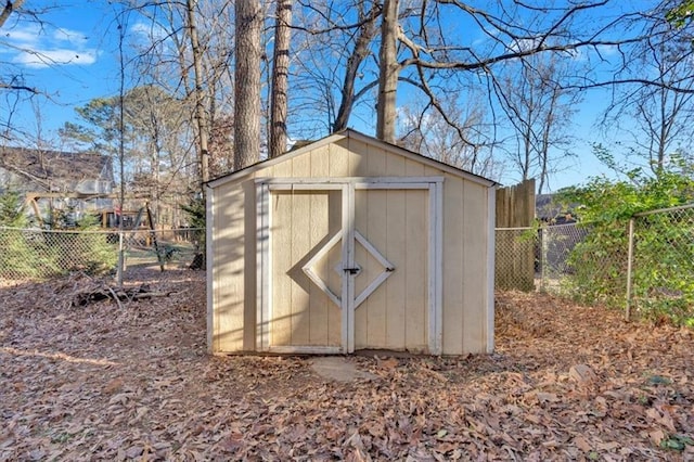 view of shed with a fenced backyard