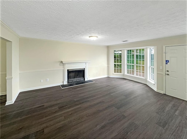 unfurnished living room with dark wood-style floors, a fireplace with raised hearth, and baseboards