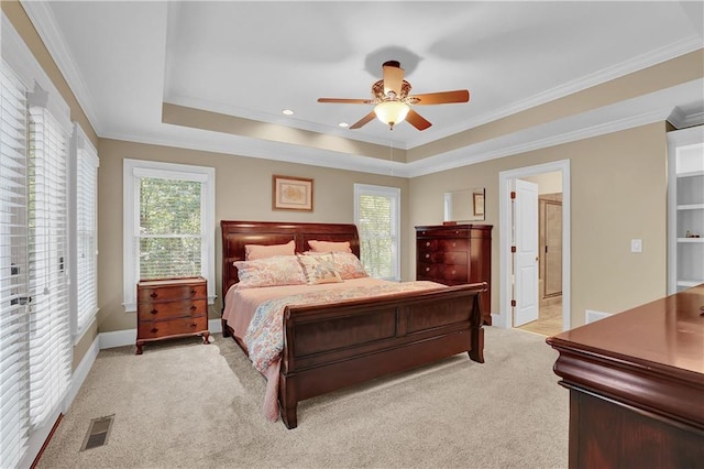 bedroom featuring light carpet, multiple windows, and ceiling fan