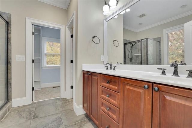 bathroom with vanity, crown molding, and walk in shower