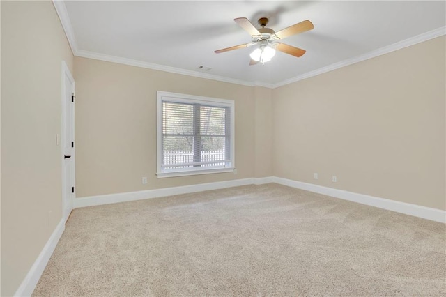 carpeted empty room featuring crown molding and ceiling fan