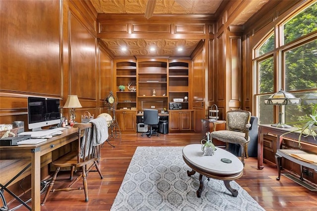 51 Mountain Ridge Dr SE, Cartersville, GA 30120 - office featuring wood finished floors, a decorative wall, wood walls, built in shelves, and built in desk
