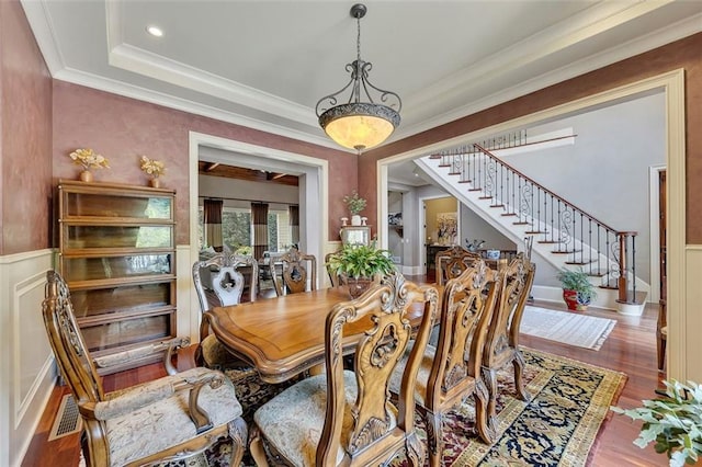 51 Mountain Ridge Dr SE, Cartersville, GA 30120 - dining area with wood finished floors, stairway, ornamental molding, and a wainscoted wall