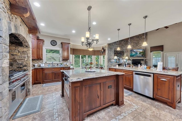 51 Mountain Ridge Dr SE, Cartersville, GA 30120 - kitchen featuring appliances with stainless steel finishes, a kitchen island, inlaid floor details, a chandelier, and ornamental molding