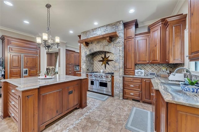51 Mountain Ridge Dr SE, Cartersville, GA 30120 - kitchen with premium appliances, crown molding, brown cabinetry, tasteful backsplash, and recessed lighting