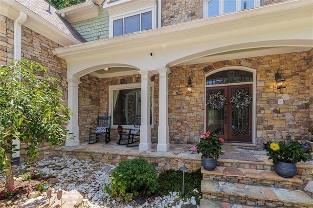 51 Mountain Ridge Dr SE, Cartersville, GA 30120 - doorway to property featuring covered porch, french doors, and stone siding