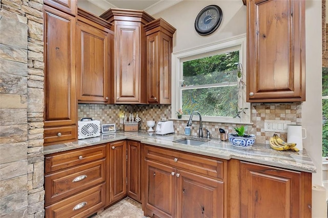 51 Mountain Ridge Dr SE, Cartersville, GA 30120 - kitchen featuring tasteful backsplash, light stone counters, brown cabinets, and ornamental molding