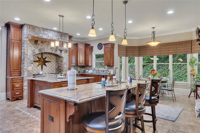 51 Mountain Ridge Dr SE, Cartersville, GA 30120 - kitchen with a large island, healthy amount of natural light, brown cabinets, crown molding, and recessed lighting