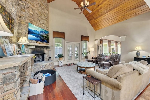 51 Mountain Ridge Dr SE, Cartersville, GA 30120 - living area with wood ceiling, high vaulted ceiling, ceiling fan, a stone fireplace, and wood finished floors