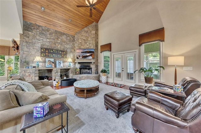 51 Mountain Ridge Dr SE, Cartersville, GA 30120 - living room featuring a stone fireplace, wood ceiling, a ceiling fan, high vaulted ceiling, and french doors