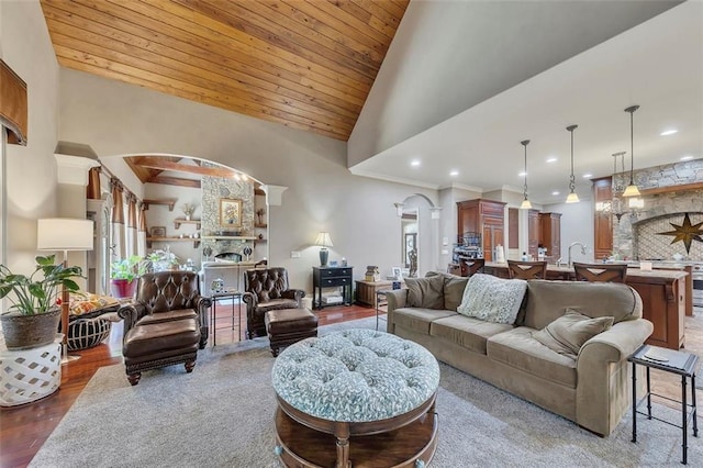 51 Mountain Ridge Dr SE, Cartersville, GA 30120 - living area featuring arched walkways, a fireplace, wooden ceiling, recessed lighting, and high vaulted ceiling
