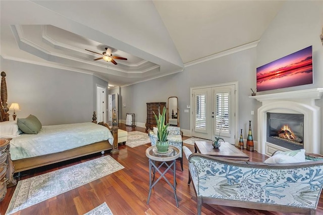 51 Mountain Ridge Dr SE, Cartersville, GA 30120 - bedroom featuring ornamental molding, access to exterior, a glass covered fireplace, wood finished floors, and a tray ceiling