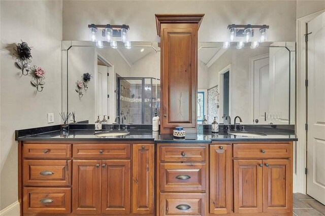 51 Mountain Ridge Dr SE, Cartersville, GA 30120 - bathroom with double vanity, a stall shower, vaulted ceiling, and tile patterned floors